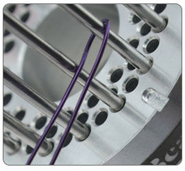 Wire being wrapped around jig pegs